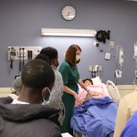 People watching hospital bed